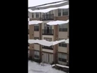 Ice cascades off roof in Plano, Texas